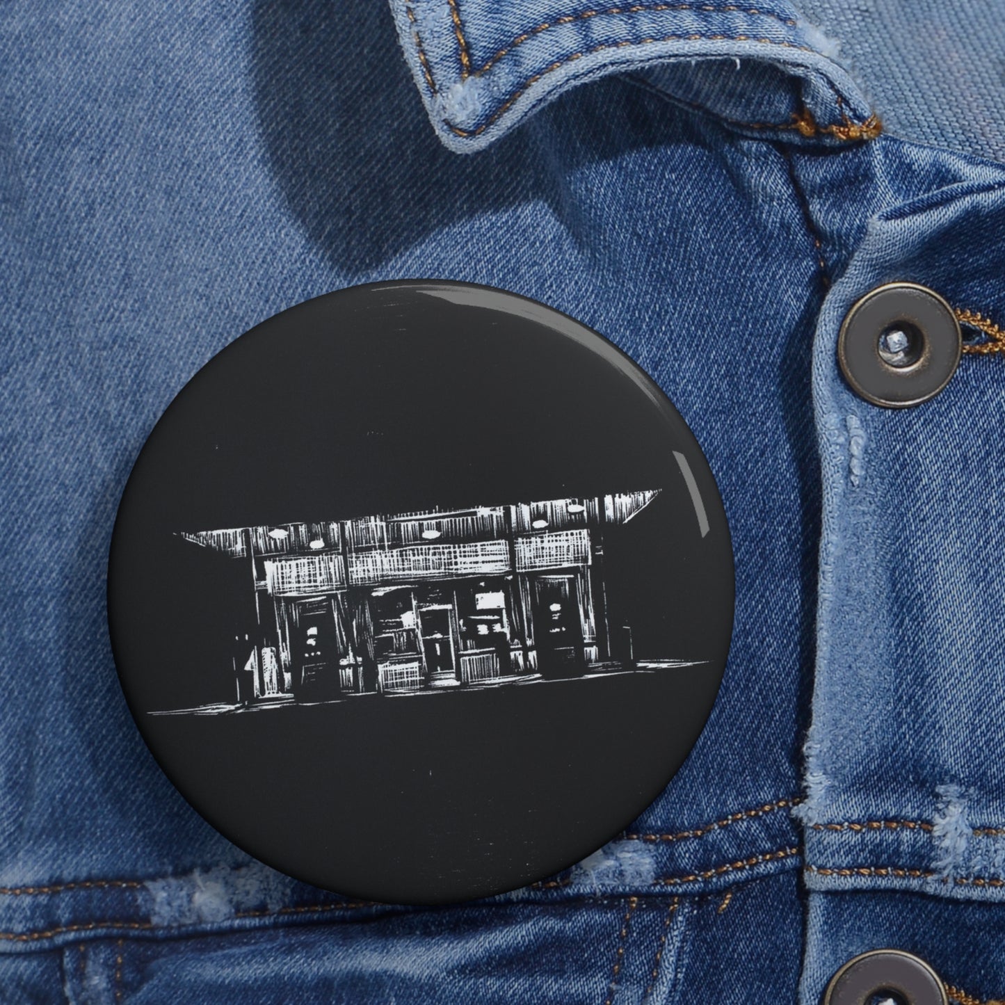 “Focus” Button/Pin of a woodblock engraving print by Paige Brown, 2022